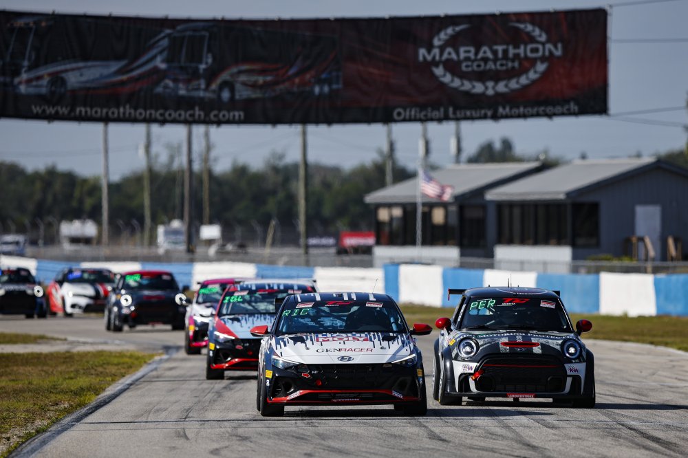 Photograph of several touring cars participating in TC America racing at Sebring in 2024